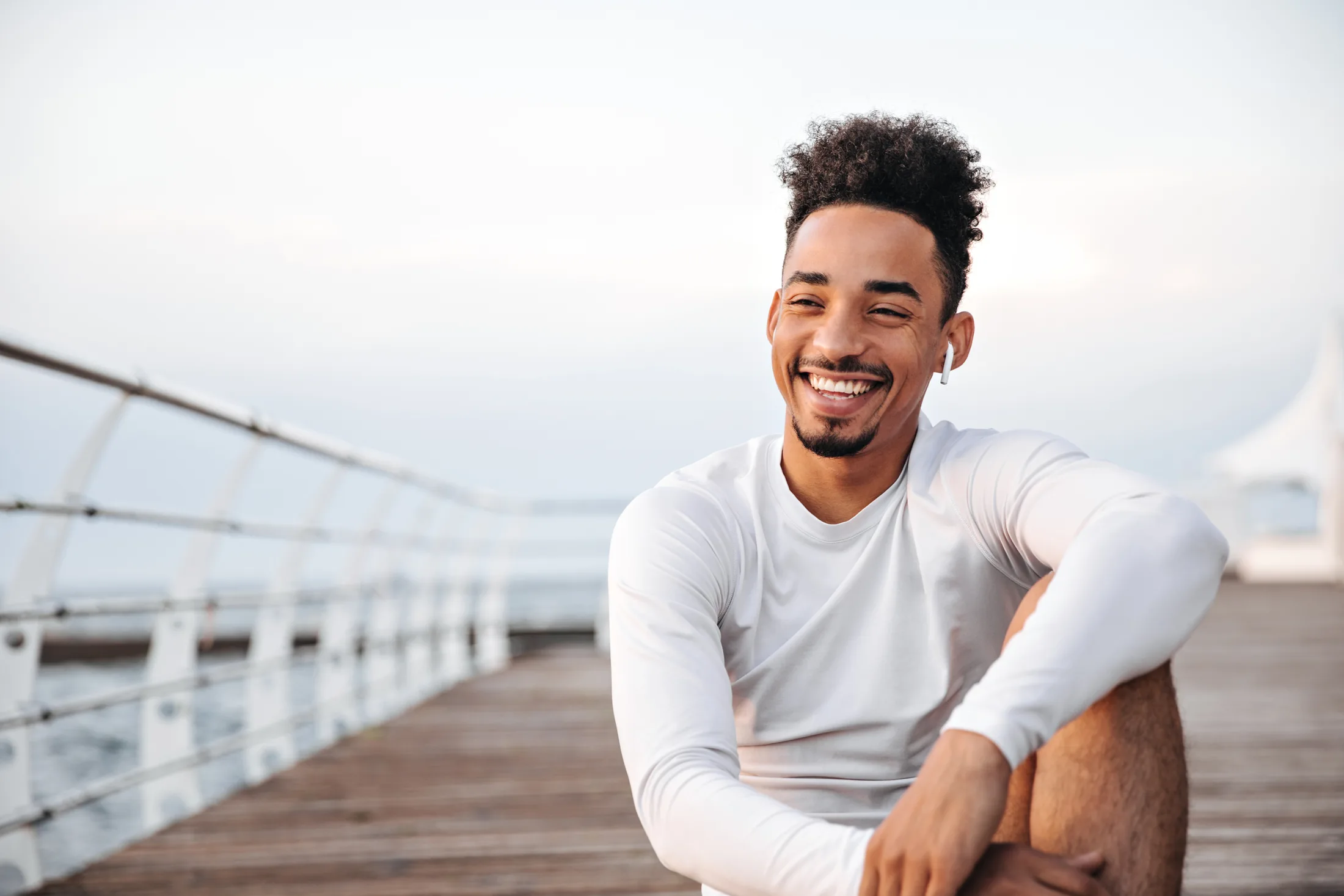 Smiling man in a bright office setting